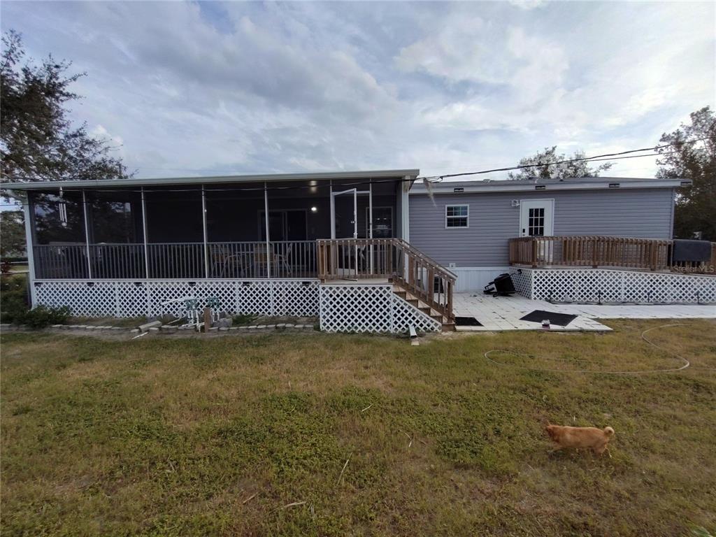 9811 Bud Street Hudson, FL 34669 - Photo 53 of 53 a front view of a house with a garden and porch