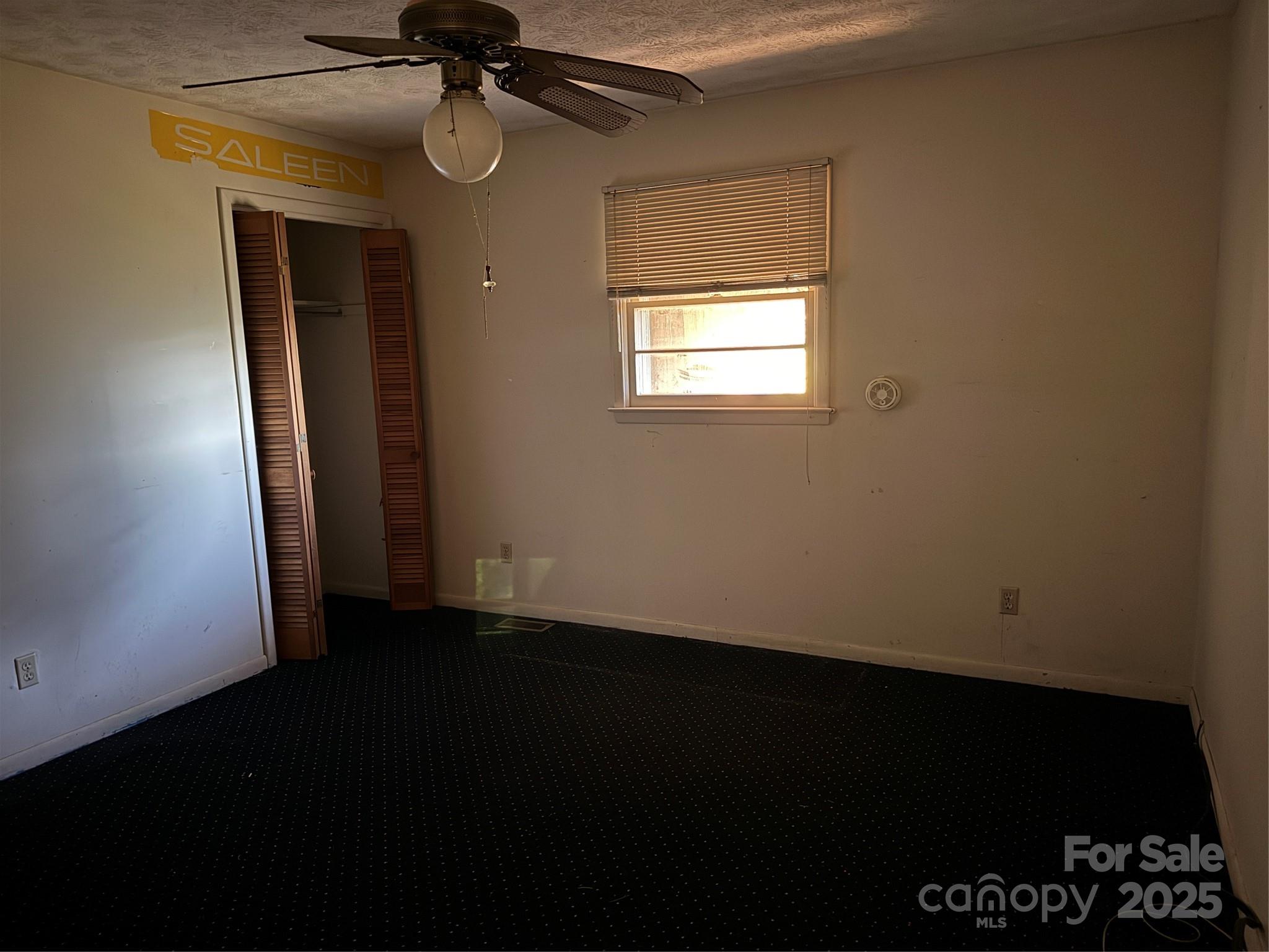 68 Sun Valley Drive Alexander, NC 28701 - Photo 5 of 15 a view of an empty room with wooden floor and a window