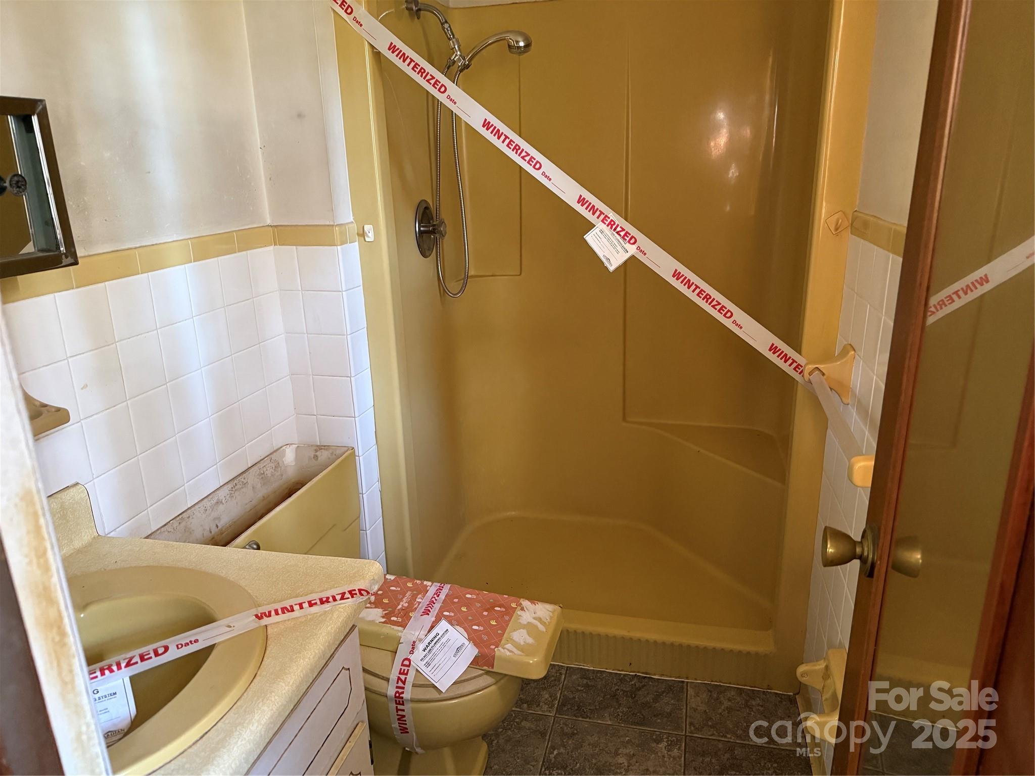 68 Sun Valley Drive Alexander, NC 28701 - Photo 8 of 15 a bathroom with a sink and toilet