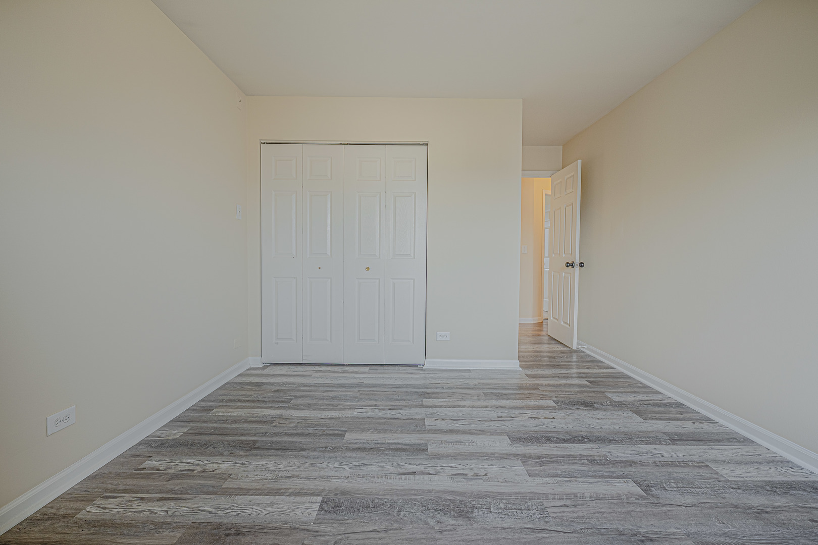 6743 Nantucket Court, Unit 6743 Gurnee, IL 60031 - Photo 17 of 30 a view of an empty room with wooden floor