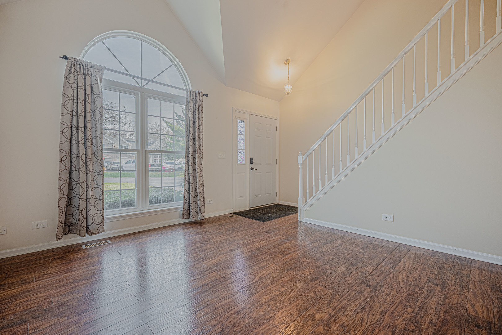6743 Nantucket Court, Unit 6743 Gurnee, IL 60031 - Photo 5 of 30 wooden floor in an empty room with a window