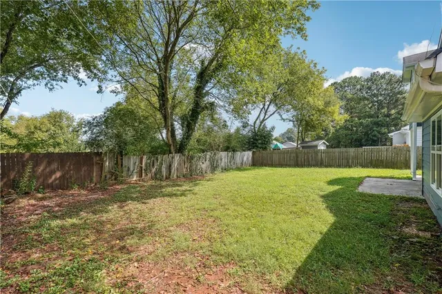 a swimming pool with wooden fence