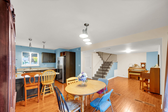 182 East 2090th Street North Provo, UT 84604 - Photo 1 of 1 Dining space featuring stairway and light wood-style flooring
