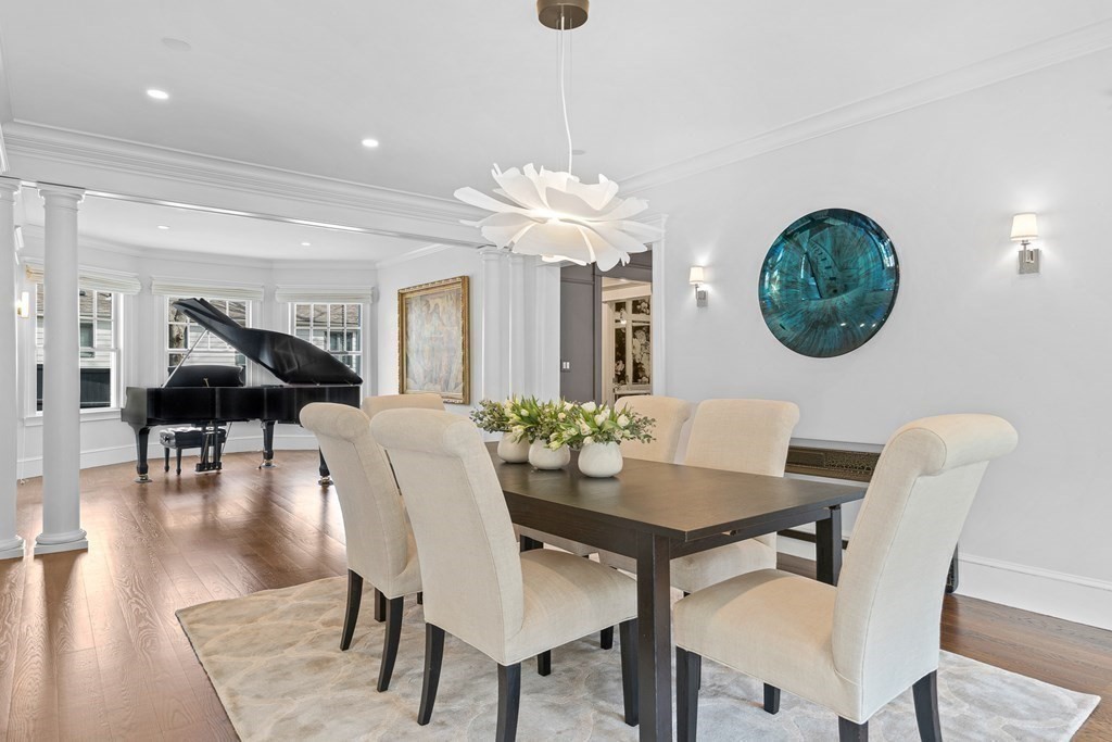 48 Everett Avenue Winchester, MA 01890 - Photo 16 of 42 a view of a dining room with furniture and wooden floor