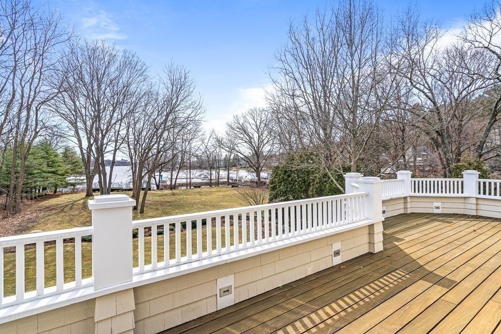 48 Everett Avenue Winchester, MA 01890 - Photo 23 of 42 a view of a balcony with wooden floor and fence