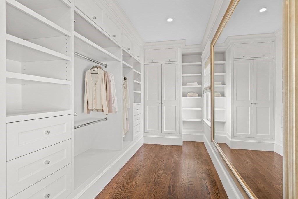 48 Everett Avenue Winchester, MA 01890 - Photo 24 of 42 a view of walk in closet with wooden floor