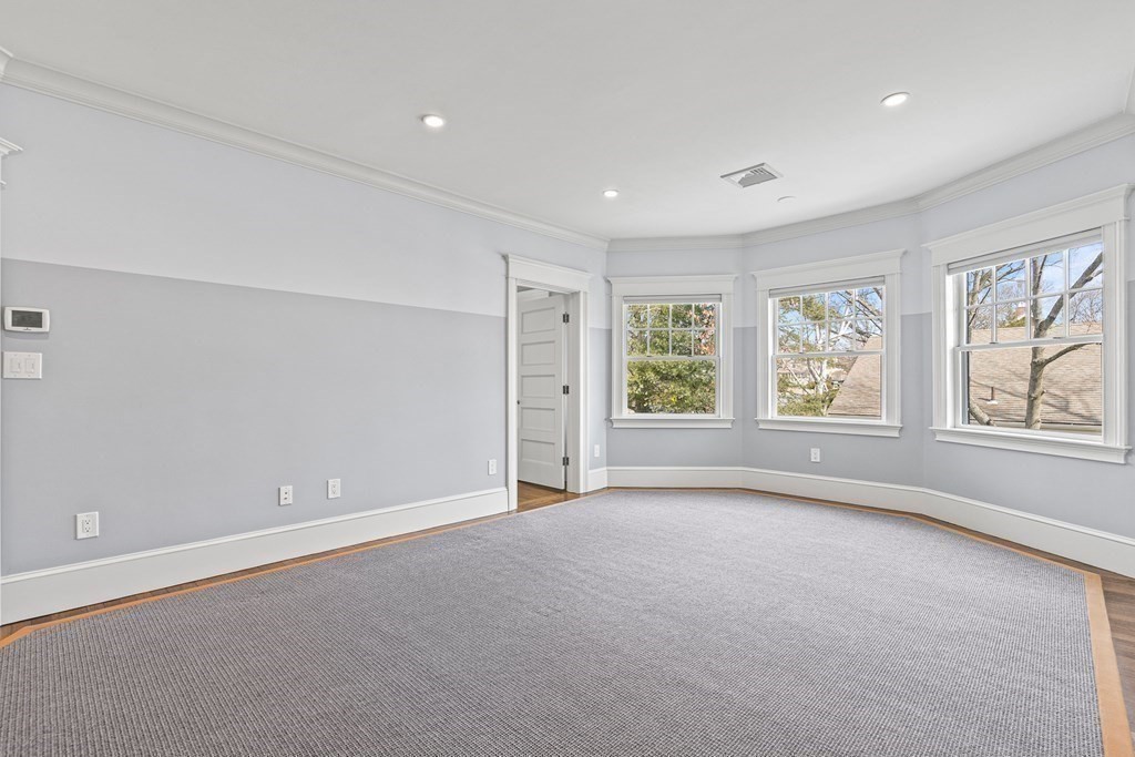 48 Everett Avenue Winchester, MA 01890 - Photo 32 of 42 a view of an empty room with a window