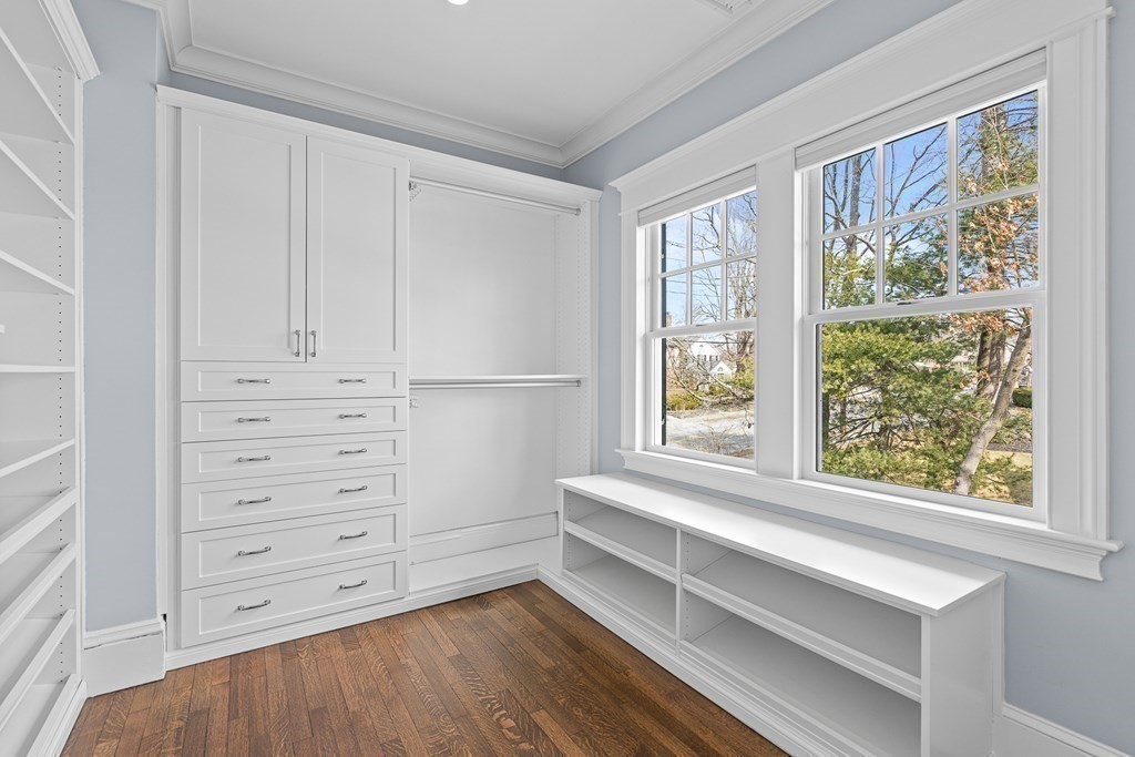 48 Everett Avenue Winchester, MA 01890 - Photo 33 of 42 a view of walk in closet with clothes