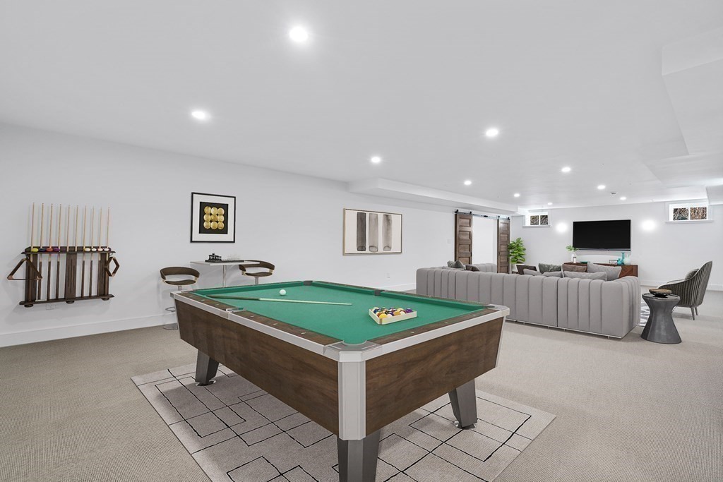 48 Everett Avenue Winchester, MA 01890 - Photo 36 of 42 a room with pool table and flat screen tv