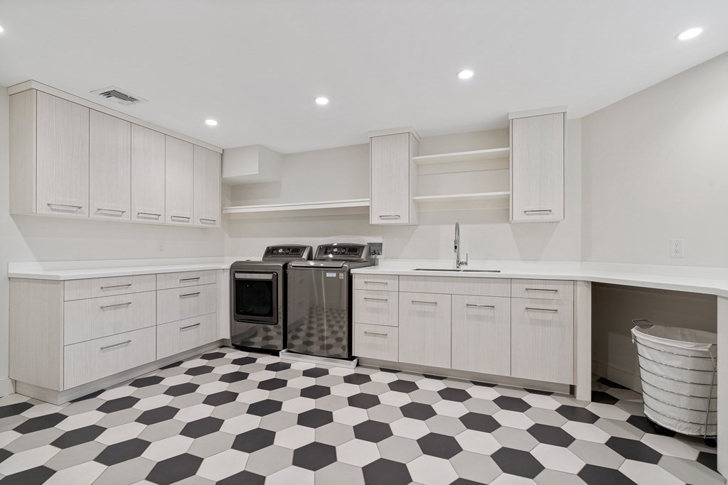 48 Everett Avenue Winchester, MA 01890 - Photo 37 of 42 a kitchen with a sink stove and cabinets
