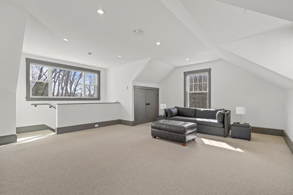 48 Everett Avenue Winchester, MA 01890 - Photo 40 of 42 a living room with furniture and a window