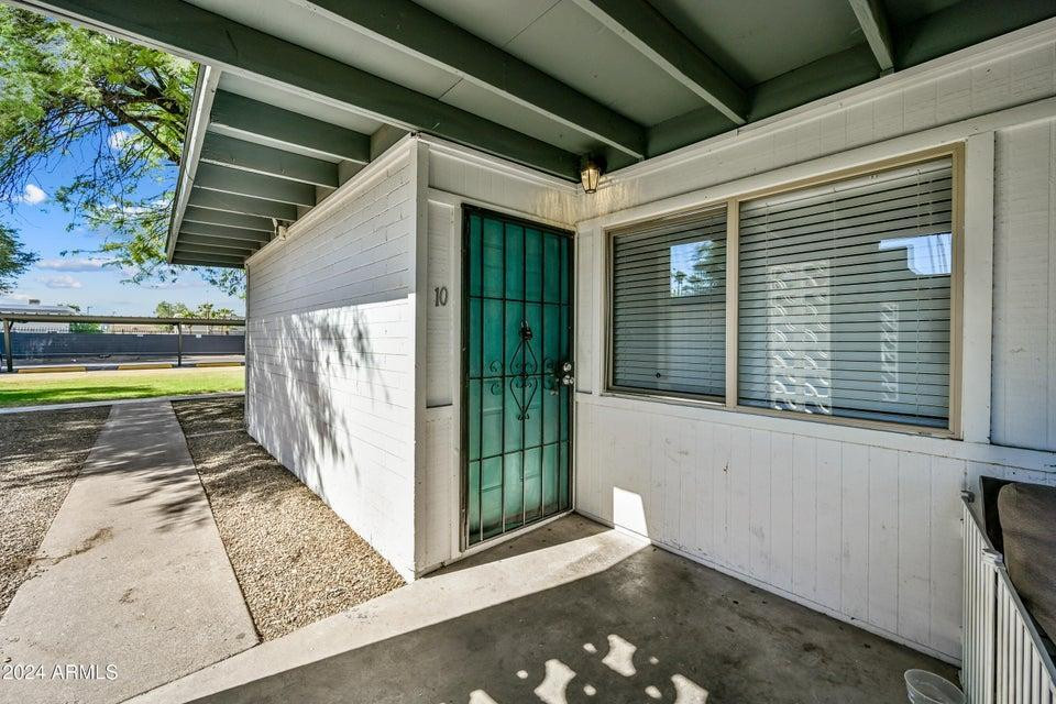 1518 West Colter Street, Unit 10 Phoenix, AZ 85015 - Photo 2 of 14 a view of a house with a backyard