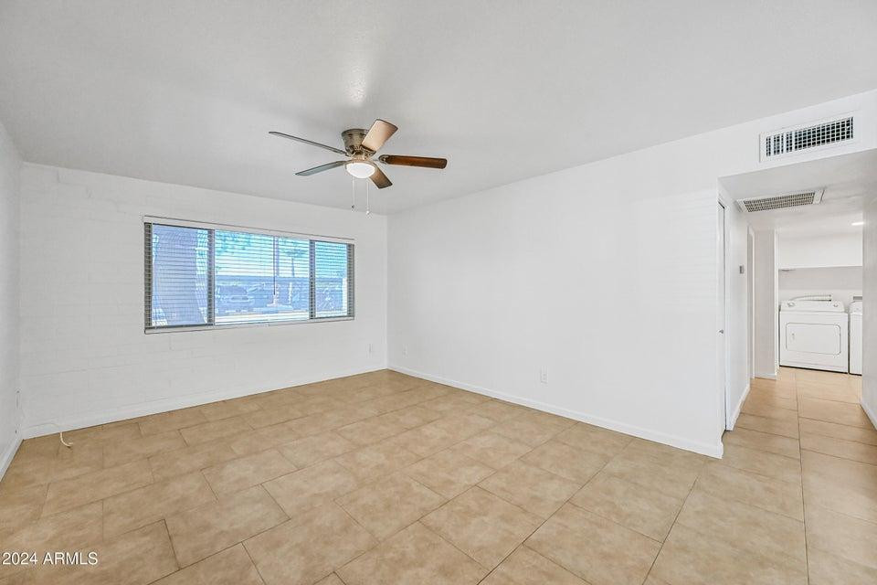 1518 West Colter Street, Unit 10 Phoenix, AZ 85015 - Photo 3 of 14 a view of an empty room with a window