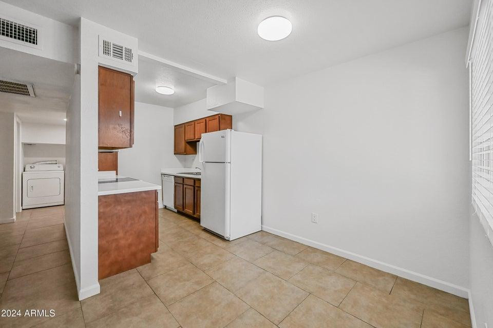 1518 West Colter Street, Unit 10 Phoenix, AZ 85015 - Photo 5 of 14 a view of a kitchen with a sink