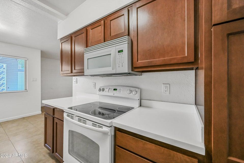 1518 West Colter Street, Unit 10 Phoenix, AZ 85015 - Photo 8 of 14 a utility room with dryer and washer