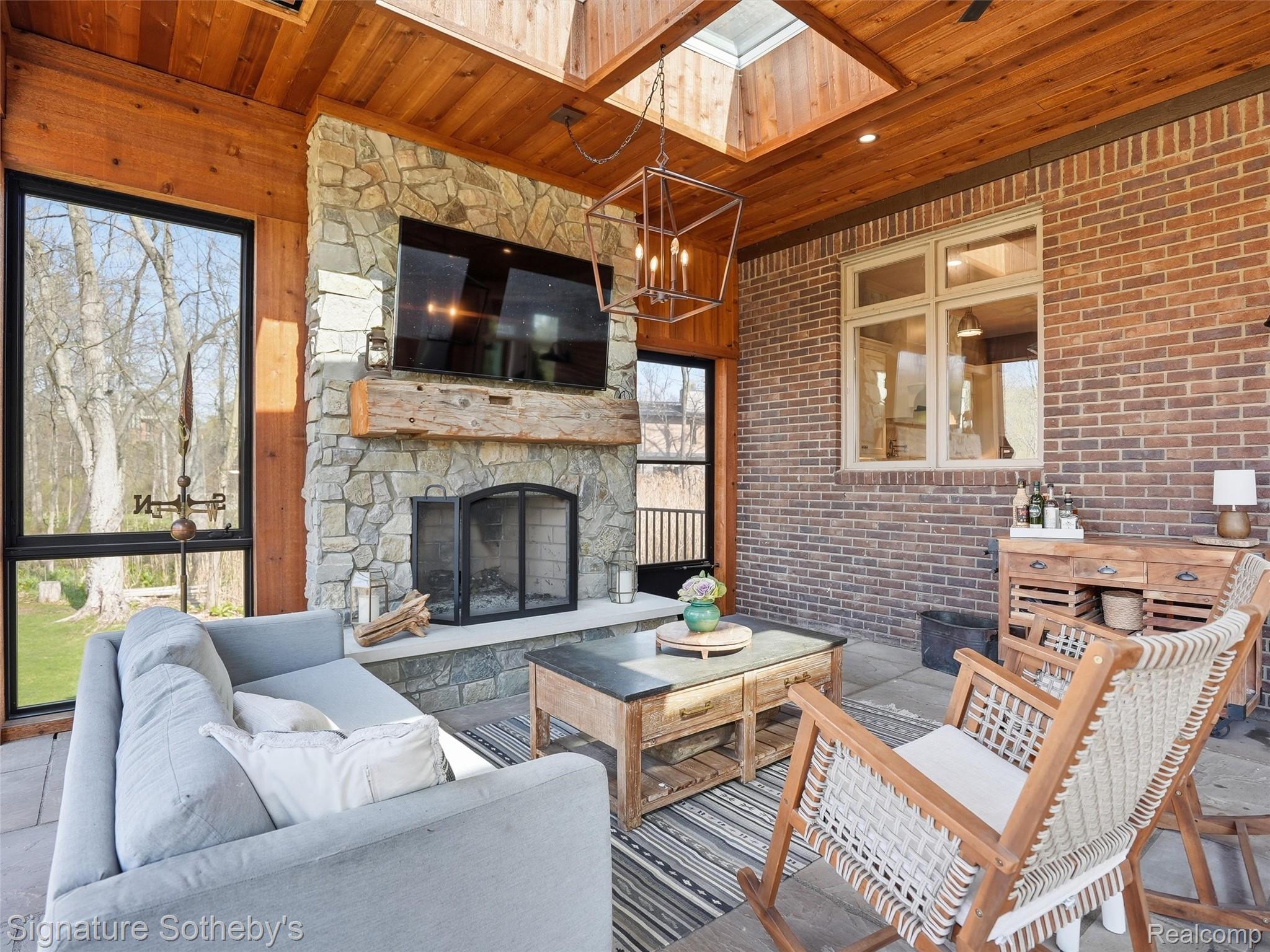 1595 Carriage Way Rochester, MI 48307 - Photo 52 of 78 Sunroom with a skylight and suspended lighting