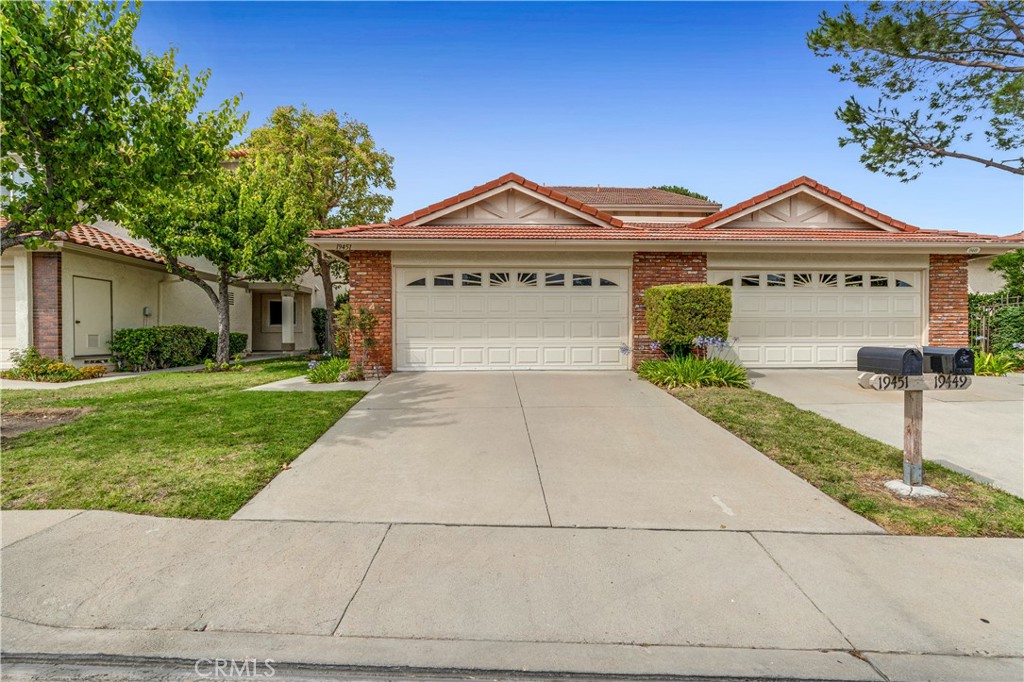 19451 Eagle Ridge Lane Porter Ranch, CA 91326 - Photo 6 of 59 a front view of a house with garden