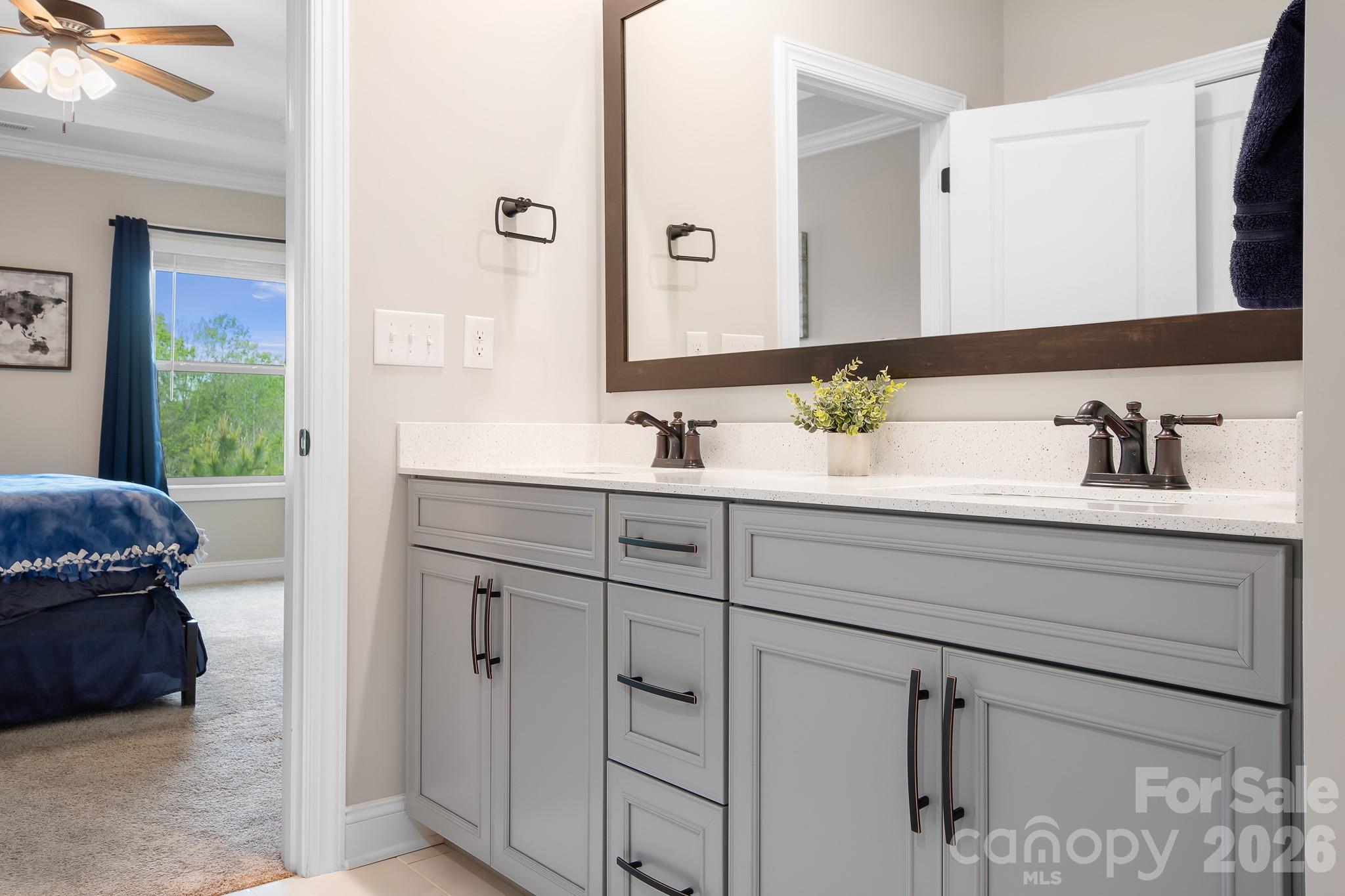 1909 Lotus Lane Denver, NC 28037 - Photo 17 of 44 a bathroom with a sink and a mirror