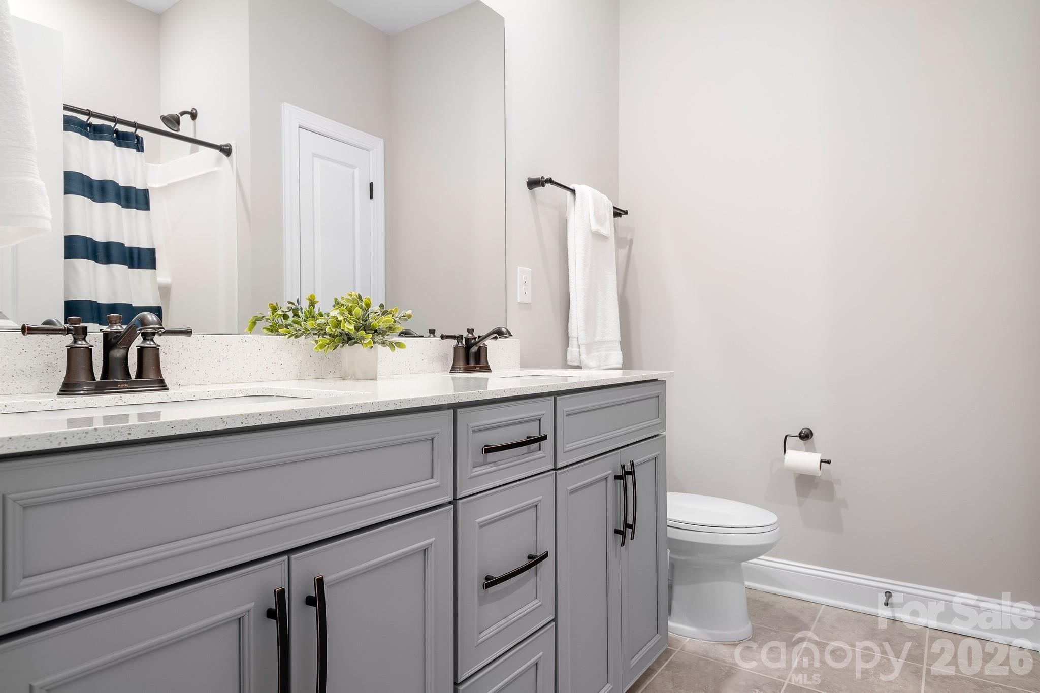 1909 Lotus Lane Denver, NC 28037 - Photo 20 of 44 a bathroom with a sink and a mirror