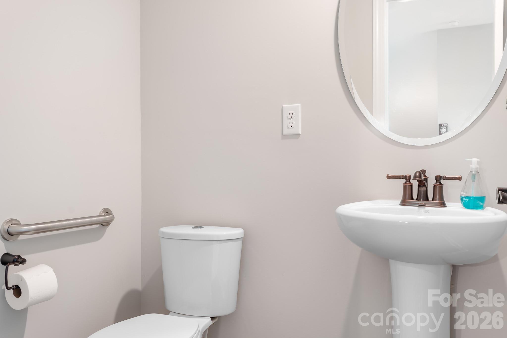 1909 Lotus Lane Denver, NC 28037 - Photo 28 of 44 a bathroom with a sink mirror and toilet