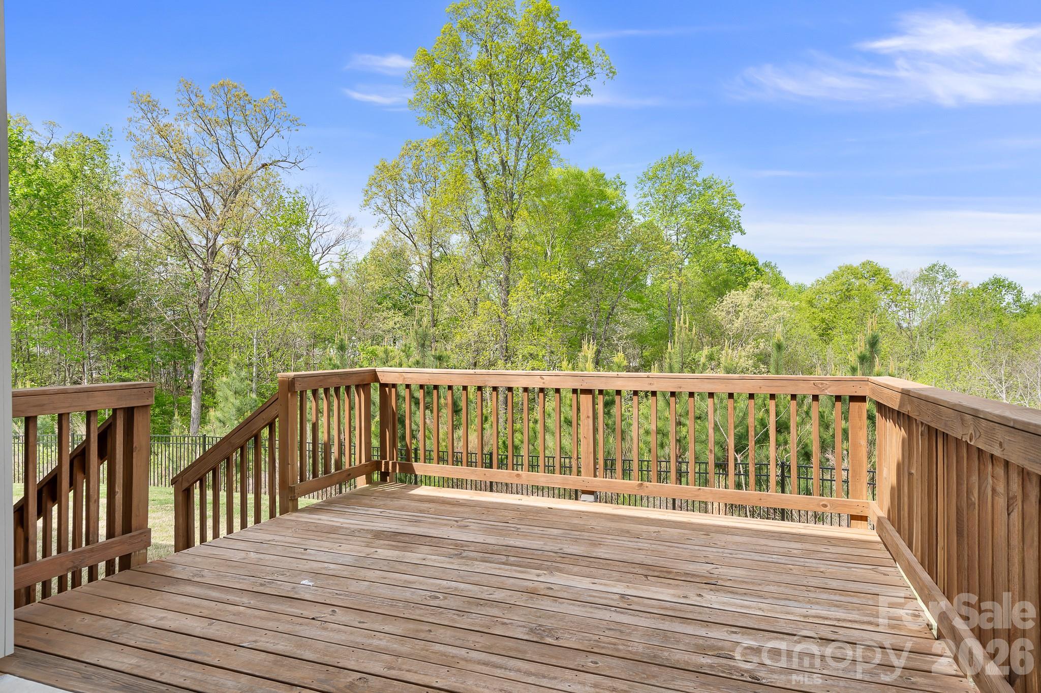 1909 Lotus Lane Denver, NC 28037 - Photo 32 of 44 a view of balcony with wooden floor and fence
