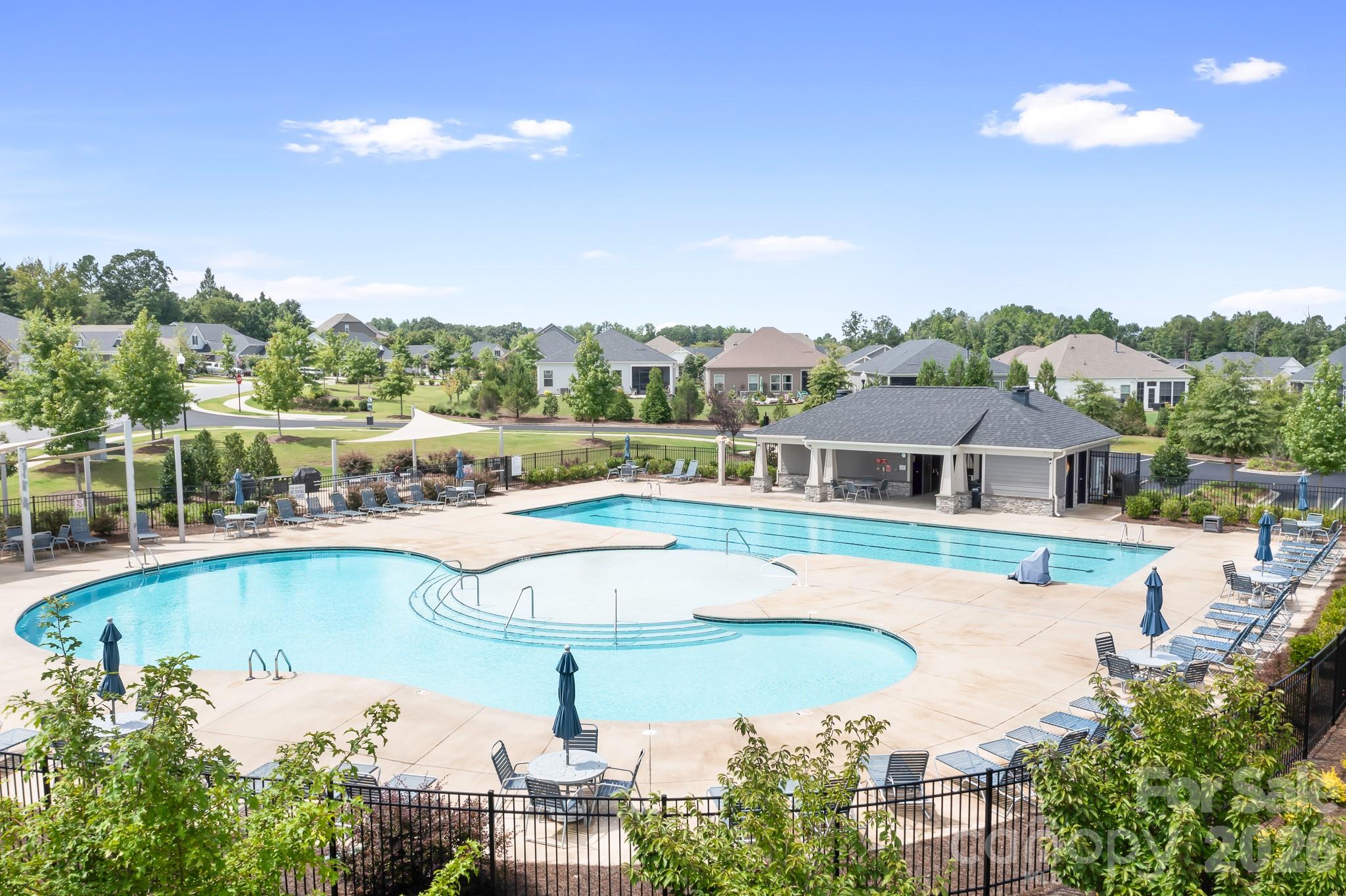 1909 Lotus Lane Denver, NC 28037 - Photo 39 of 44 a view of a swimming pool with outdoor seating and plants