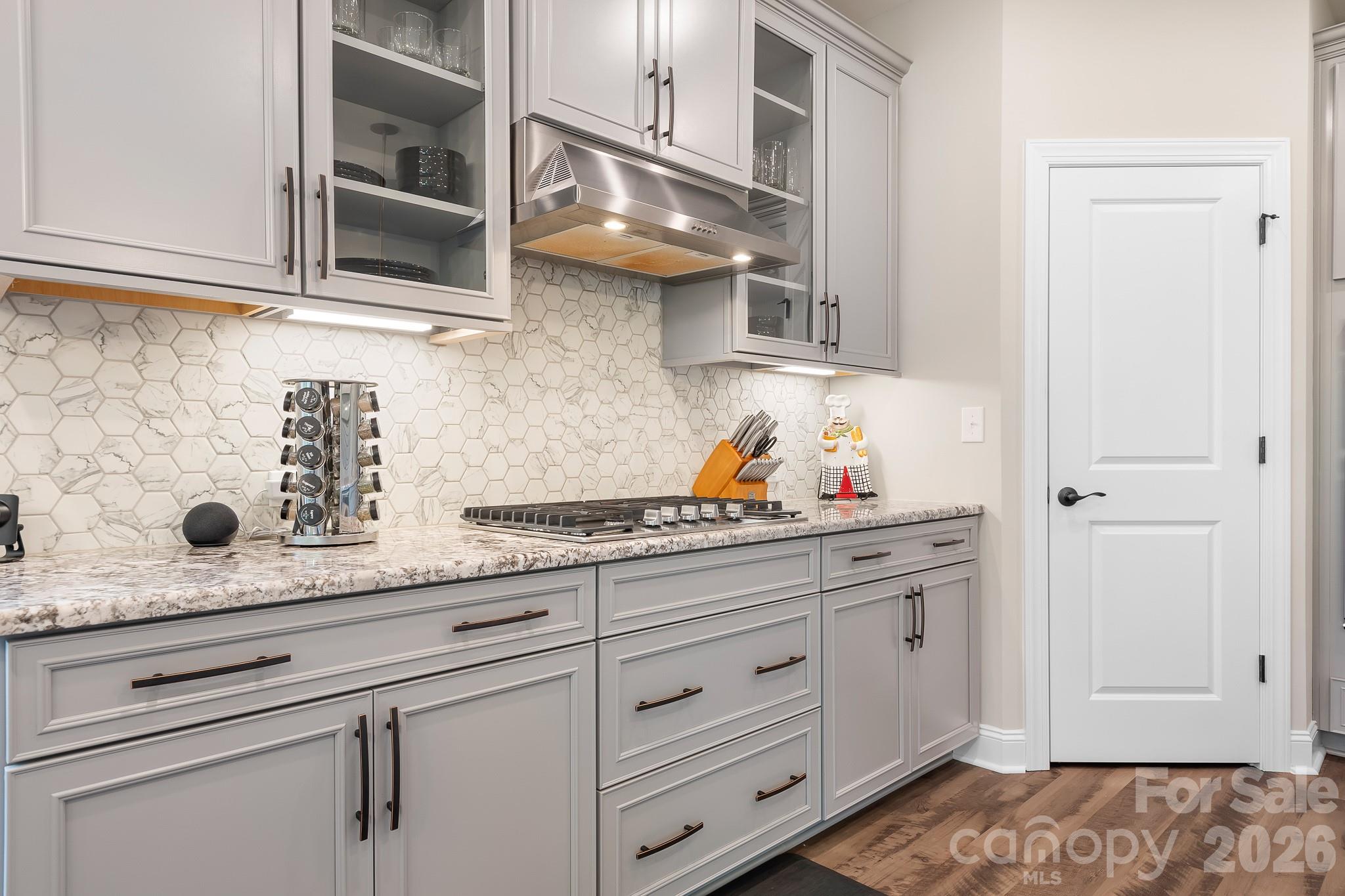 1909 Lotus Lane Denver, NC 28037 - Photo 9 of 44 a kitchen with granite countertop white cabinets and white appliances