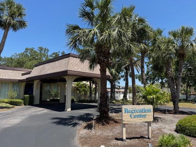 11485 Oakhurst Road, Unit 319 Largo, FL 33774 - Photo 38 of 63 a view of a car park in front of a house