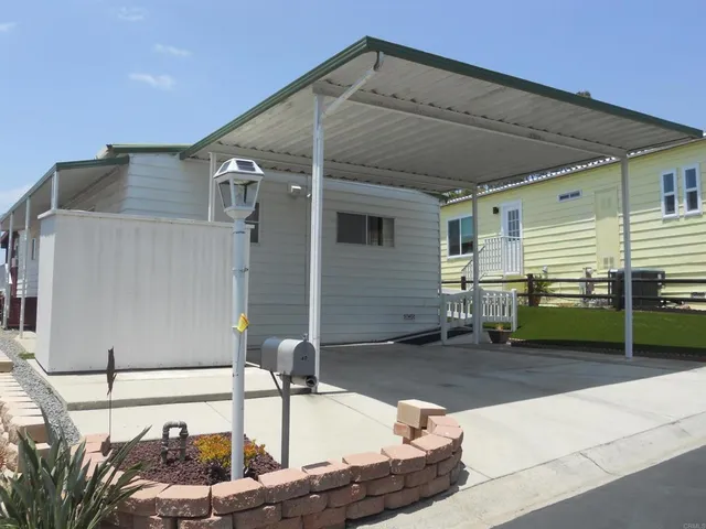 a view of a house with a sink and a yard