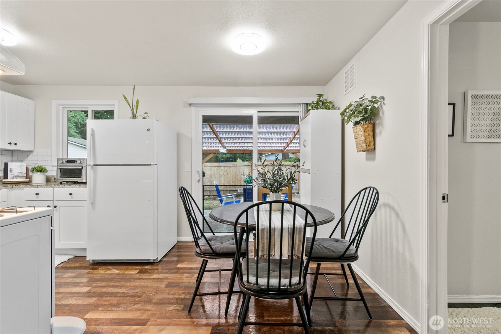 26604 191st Place Southeast Covington, WA 98042 - Photo 14 of 34 a view of dining room and kitchen with a table chairs