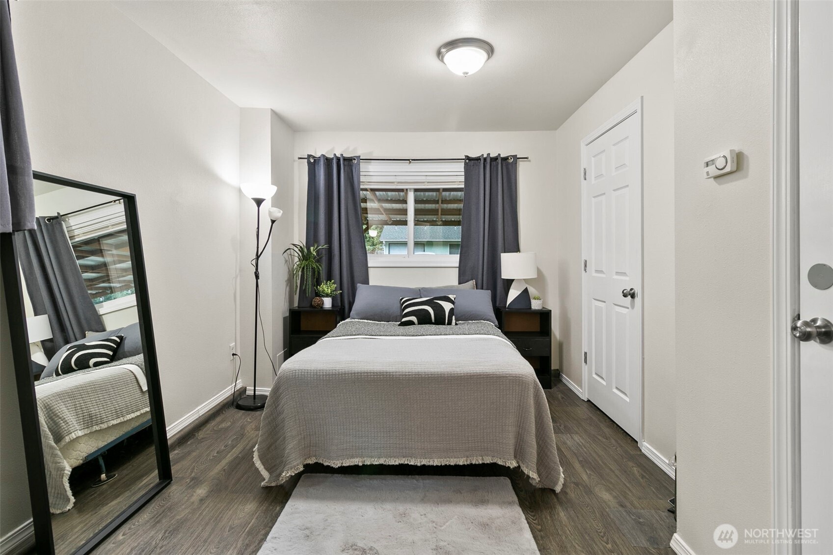 26604 191st Place Southeast Covington, WA 98042 - Photo 22 of 34 a bedroom with a bed and a mirror