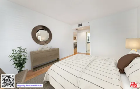 a bedroom with a bed mirror and a potted plant