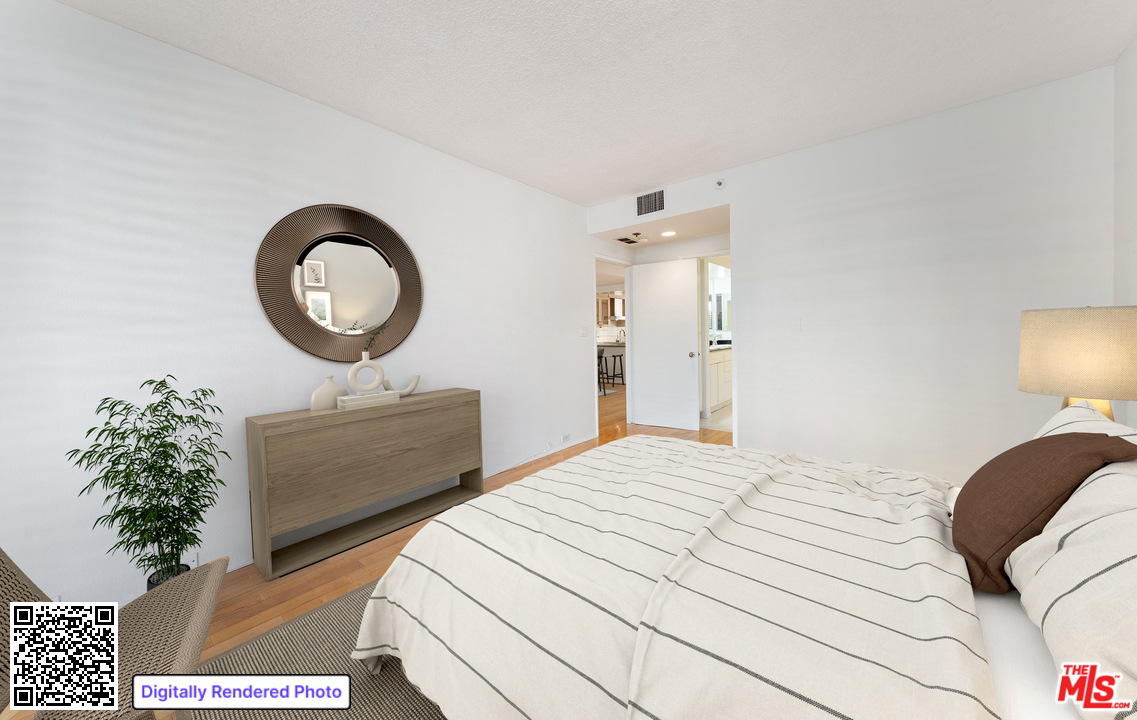 2910 Neilson Way, Unit 308 Santa Monica, CA 90405 - Photo 15 of 32 a bedroom with a bed mirror and a potted plant