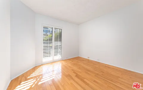 a view of a bedroom with a window