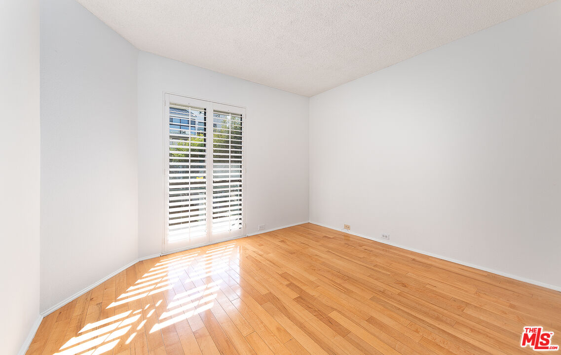 2910 Neilson Way, Unit 308 Santa Monica, CA 90405 - Photo 21 of 32 a view of a bedroom with a window