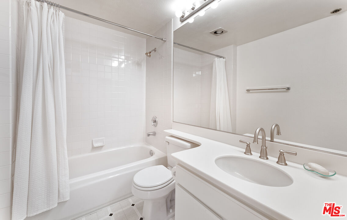2910 Neilson Way, Unit 308 Santa Monica, CA 90405 - Photo 22 of 32 a bathroom with a sink toilet and shower