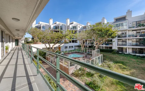 a view of swimming pool from a balcony