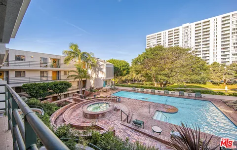a view of swimming pool with outdoor seating