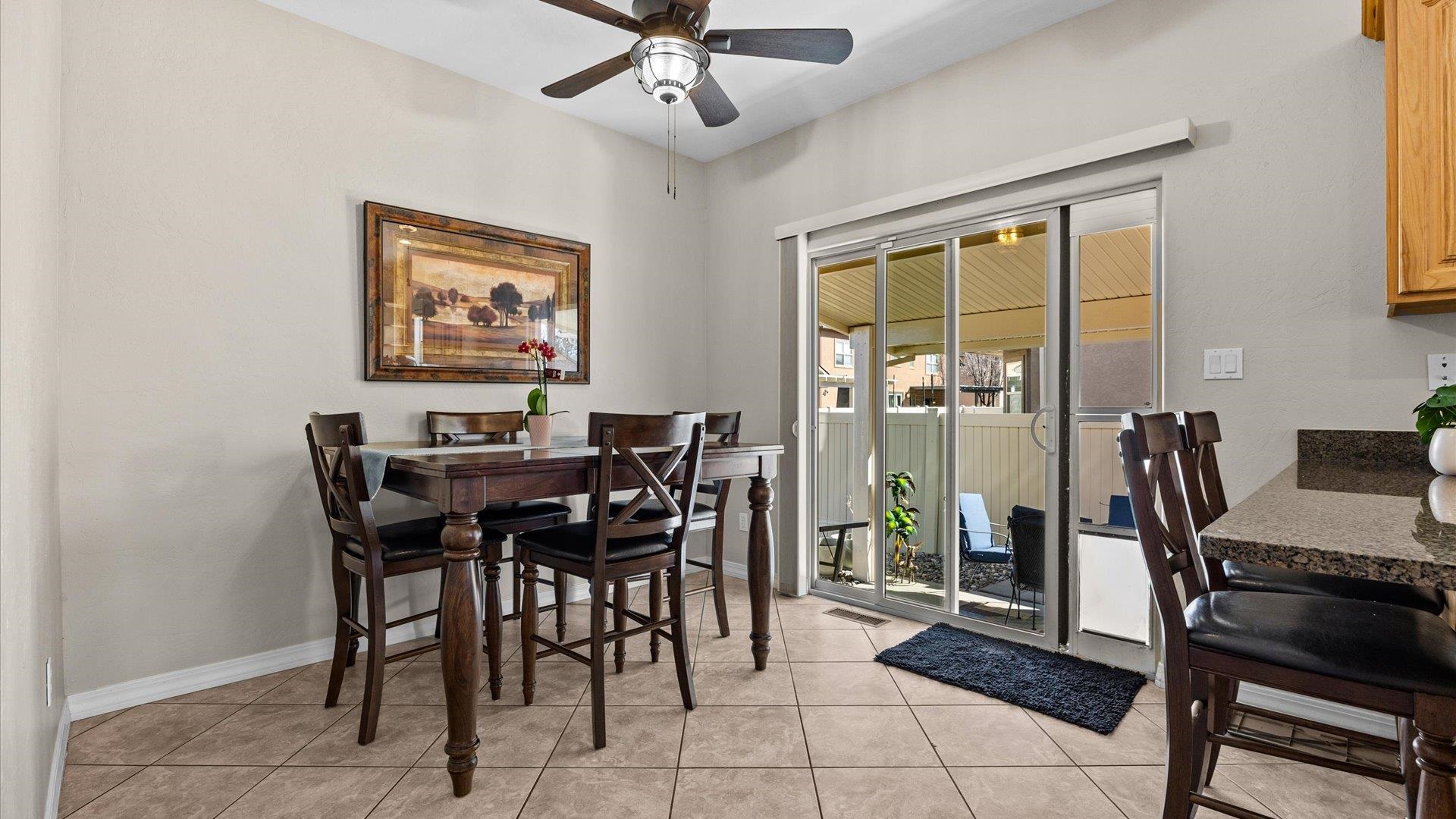 1427 Satterfield Avenue Fruita, CO 81521 - Photo 12 of 29 a view of a dining room with furniture and a window