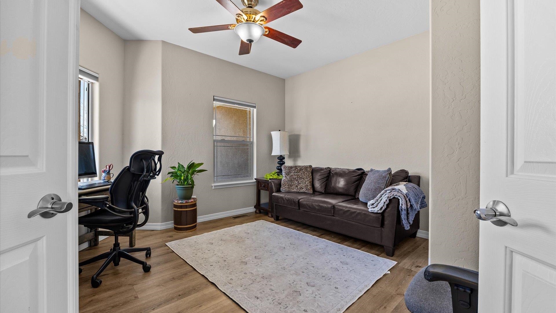 1427 Satterfield Avenue Fruita, CO 81521 - Photo 14 of 29 a living room with furniture and wooden floor