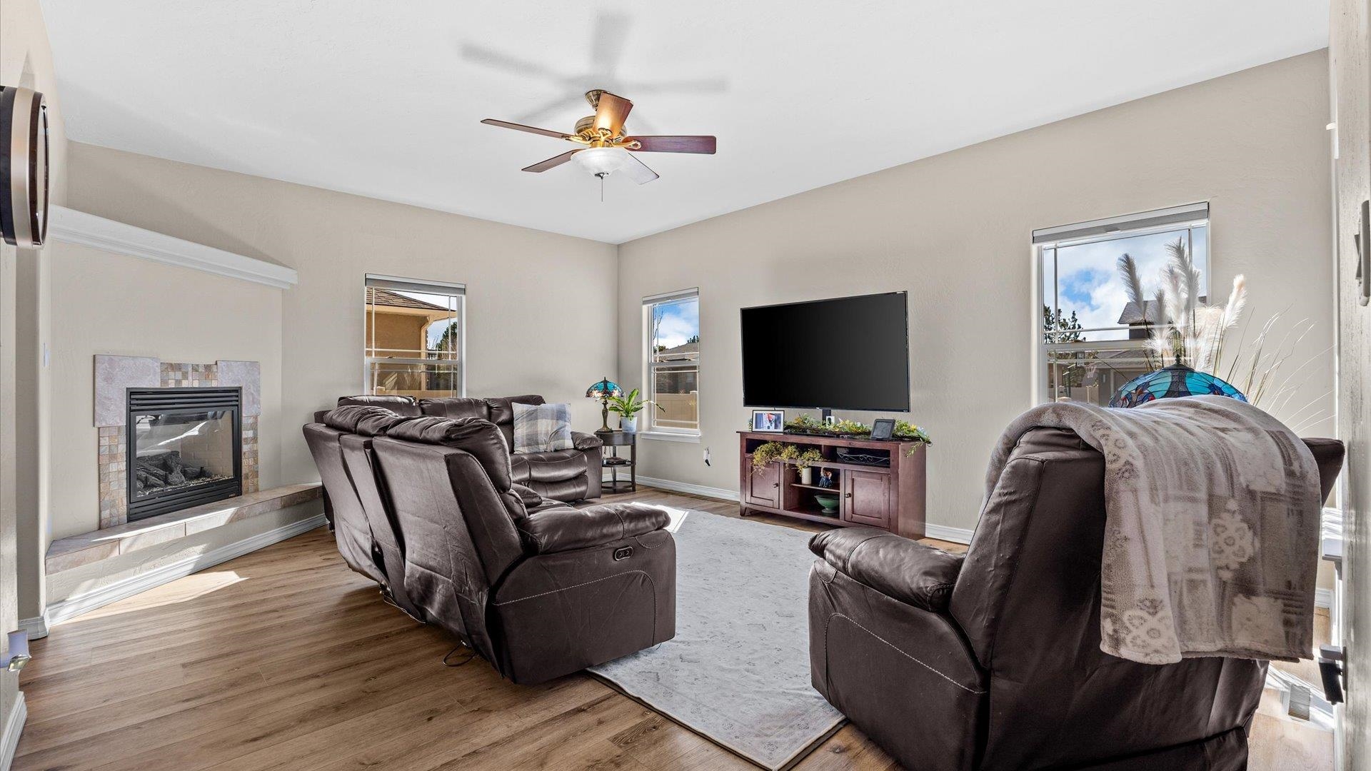 1427 Satterfield Avenue Fruita, CO 81521 - Photo 8 of 29 a living room with furniture and a flat screen tv