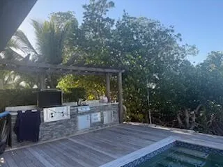 swimming pool view with a seating space