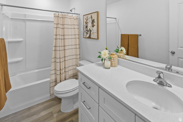 1264 West 500 South, Unit 320 Logan, UT 84321 - Photo 27 of 39 Bathroom featuring a white vanity with an integrated sink, polished chrome faucet, and a large mirror