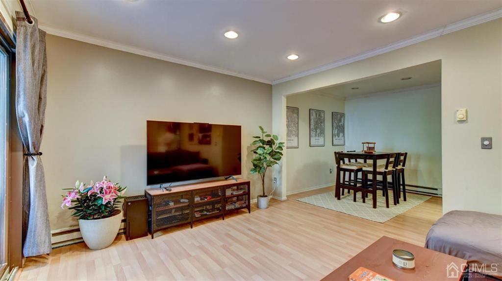 3 The Crescent Clinton, NJ 08809 - Photo 11 of 37 a living room with furniture and a flat screen tv