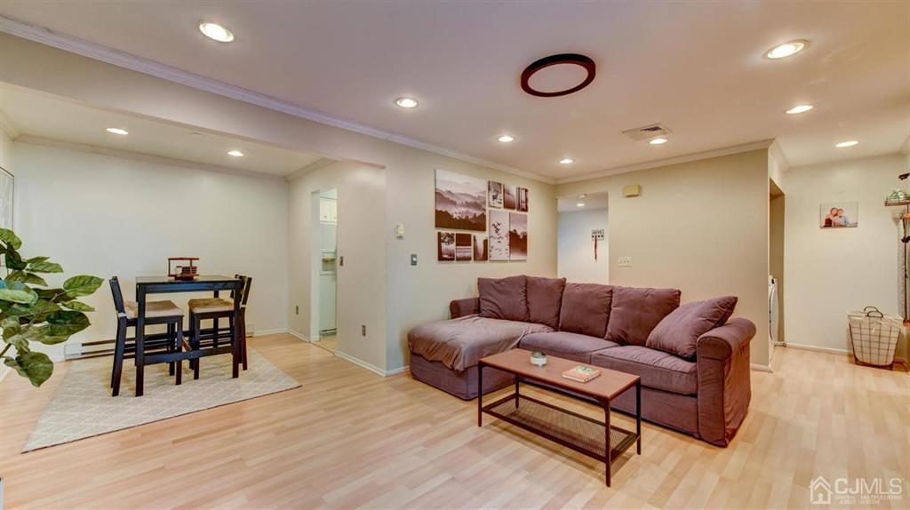 3 The Crescent Clinton, NJ 08809 - Photo 13 of 37 a living room with furniture and a wooden floor