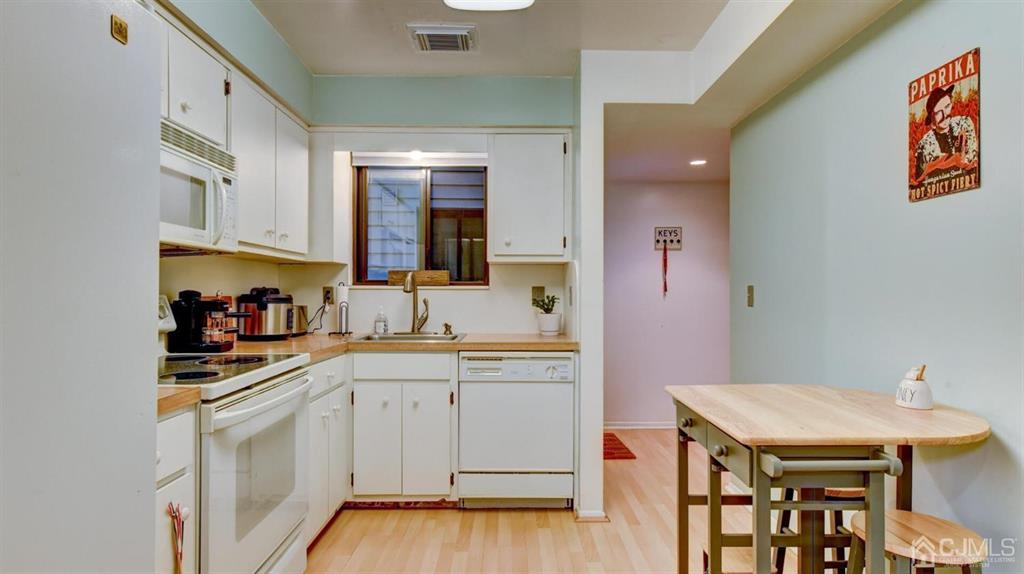 3 The Crescent Clinton, NJ 08809 - Photo 17 of 37 a kitchen with a sink cabinets and wooden floor