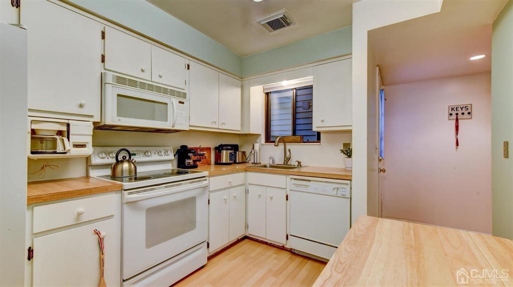 3 The Crescent Clinton, NJ 08809 - Photo 18 of 37 a kitchen with stainless steel appliances granite countertop a sink and cabinets