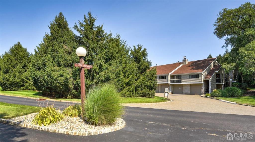 3 The Crescent Clinton, NJ 08809 - Photo 2 of 37 a front view of a house with a yard and trees