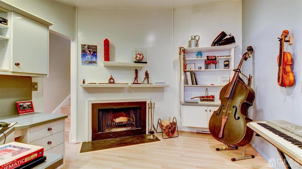 3 The Crescent Clinton, NJ 08809 - Photo 23 of 37 a view of a workspace with furniture and a fireplace