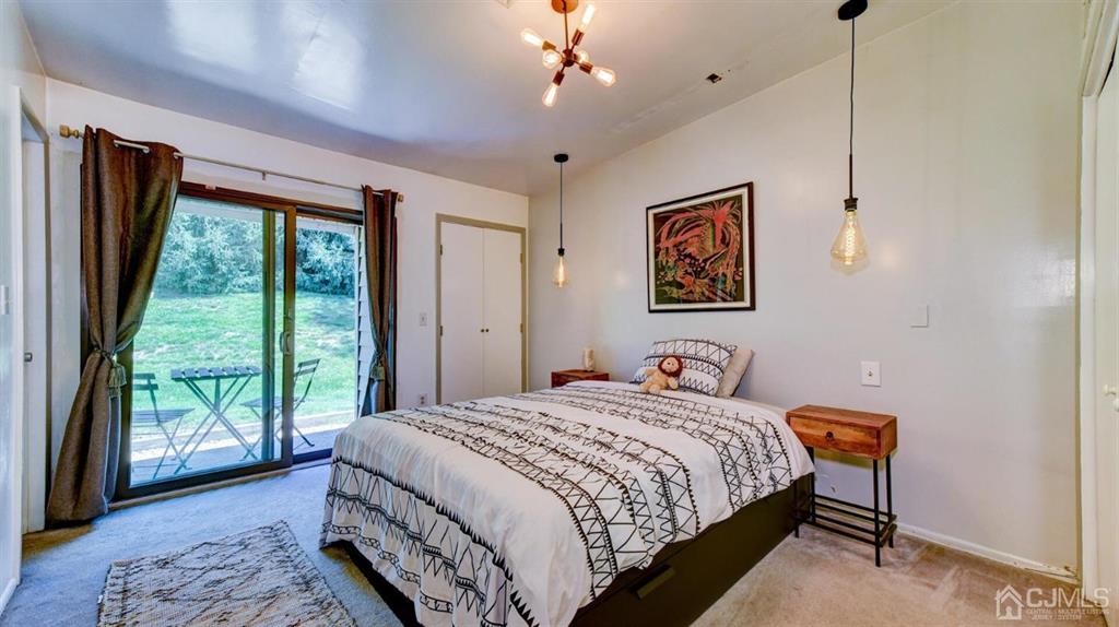 3 The Crescent Clinton, NJ 08809 - Photo 28 of 37 a bedroom with a large bed and a window